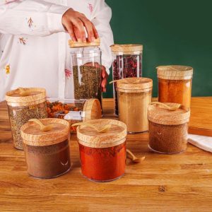 طقم 9 علب أكريليك شفافة مع أغطية خشبية وملصقات توابل لتنظيم البقوليات والبهارات بأناقة pack of 9 clear acrylic canisters with wooden lids and spice labels for organized food storage